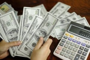 businessmen-women-counting-money